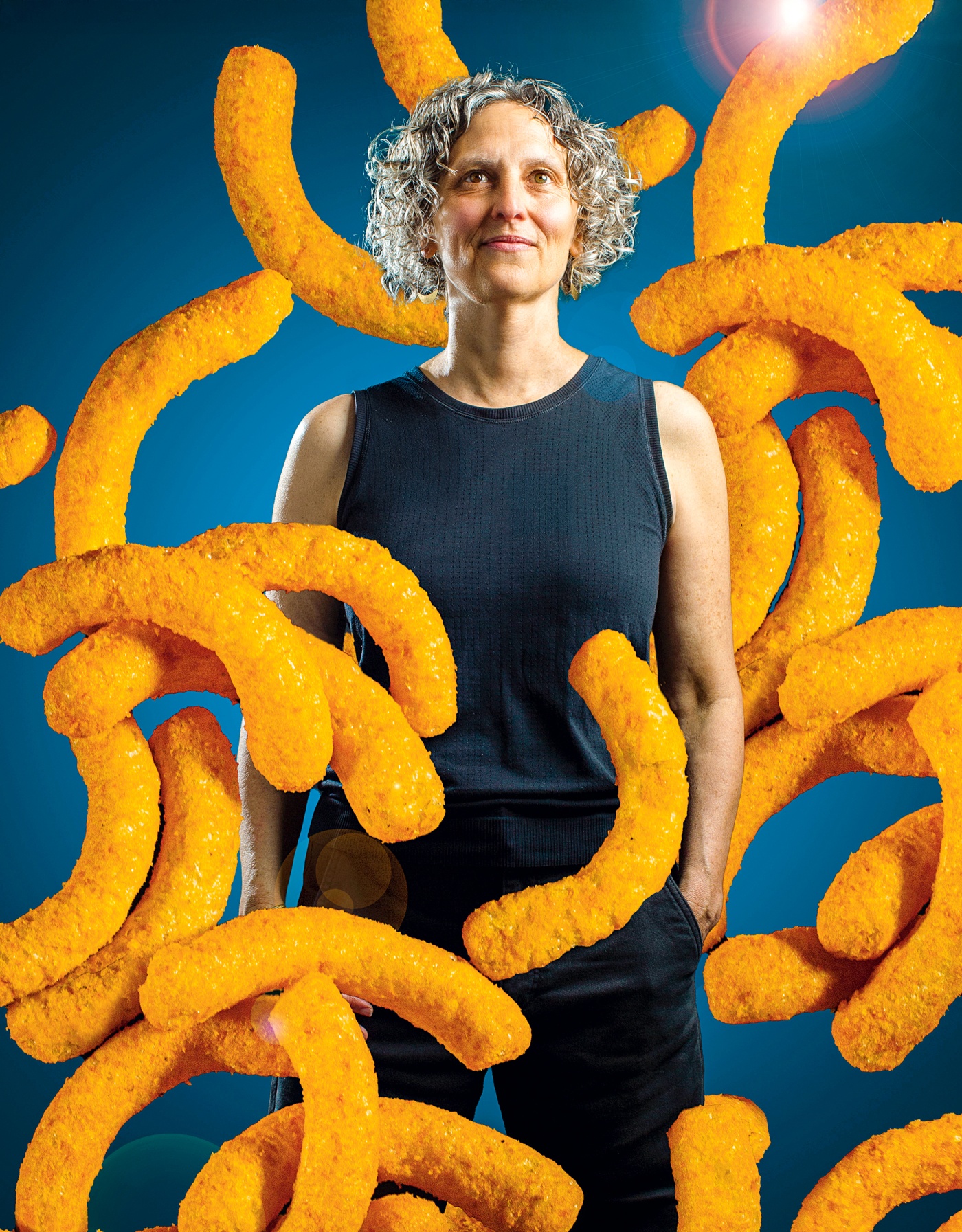 portrait of Charlotte Biltekoff surrounded by cheetos